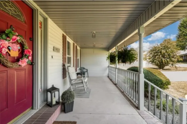 a view of a patio with wooden floor