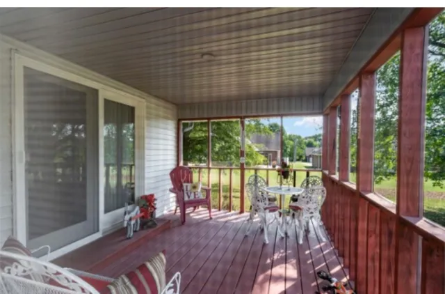 a kitchen with stainless steel appliances a sink a stove a refrigerator and cabinets