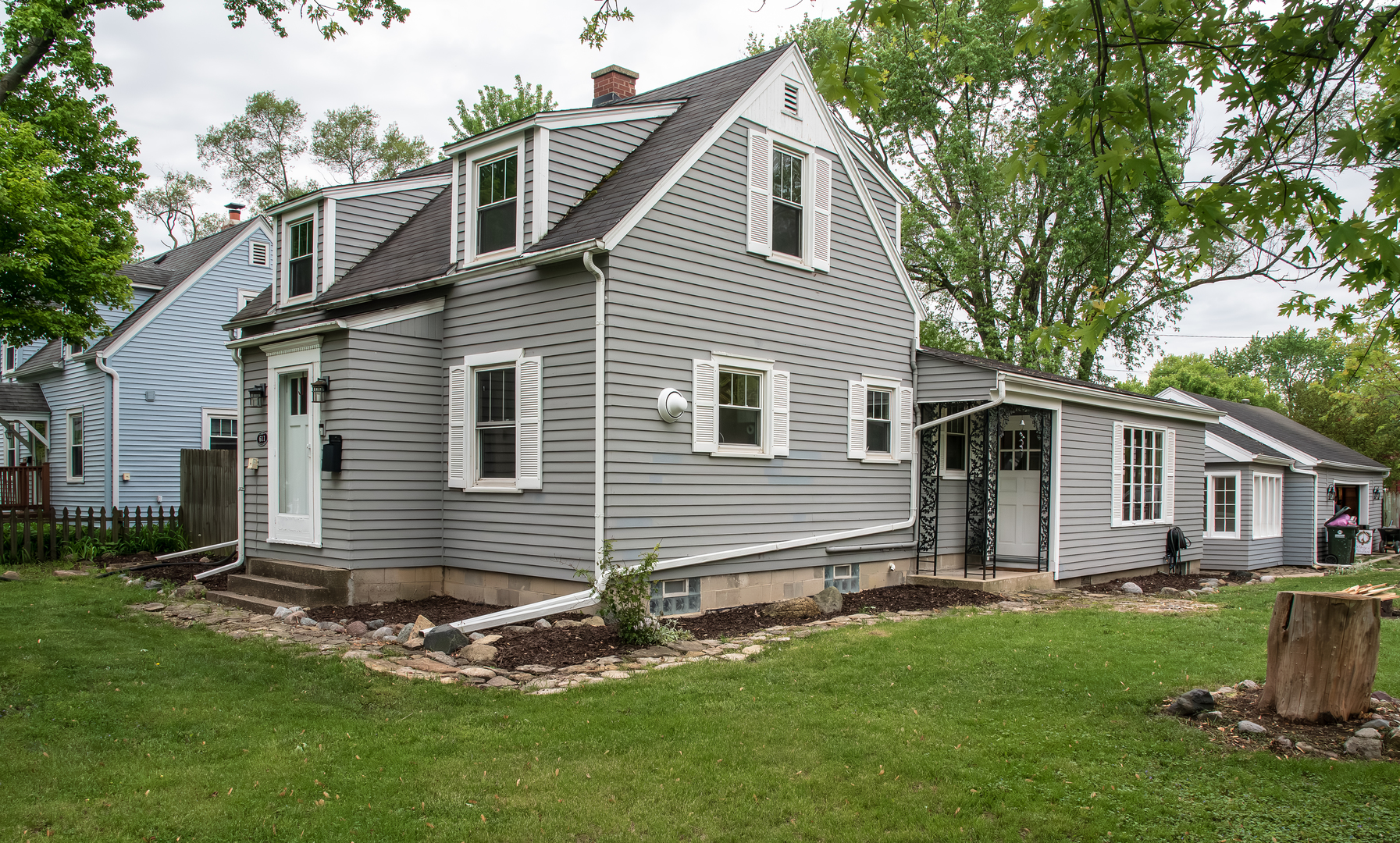 611 North Cedar Road New Lenox, IL 60451 - Photo 2 of 30 a front view of a house with a garden