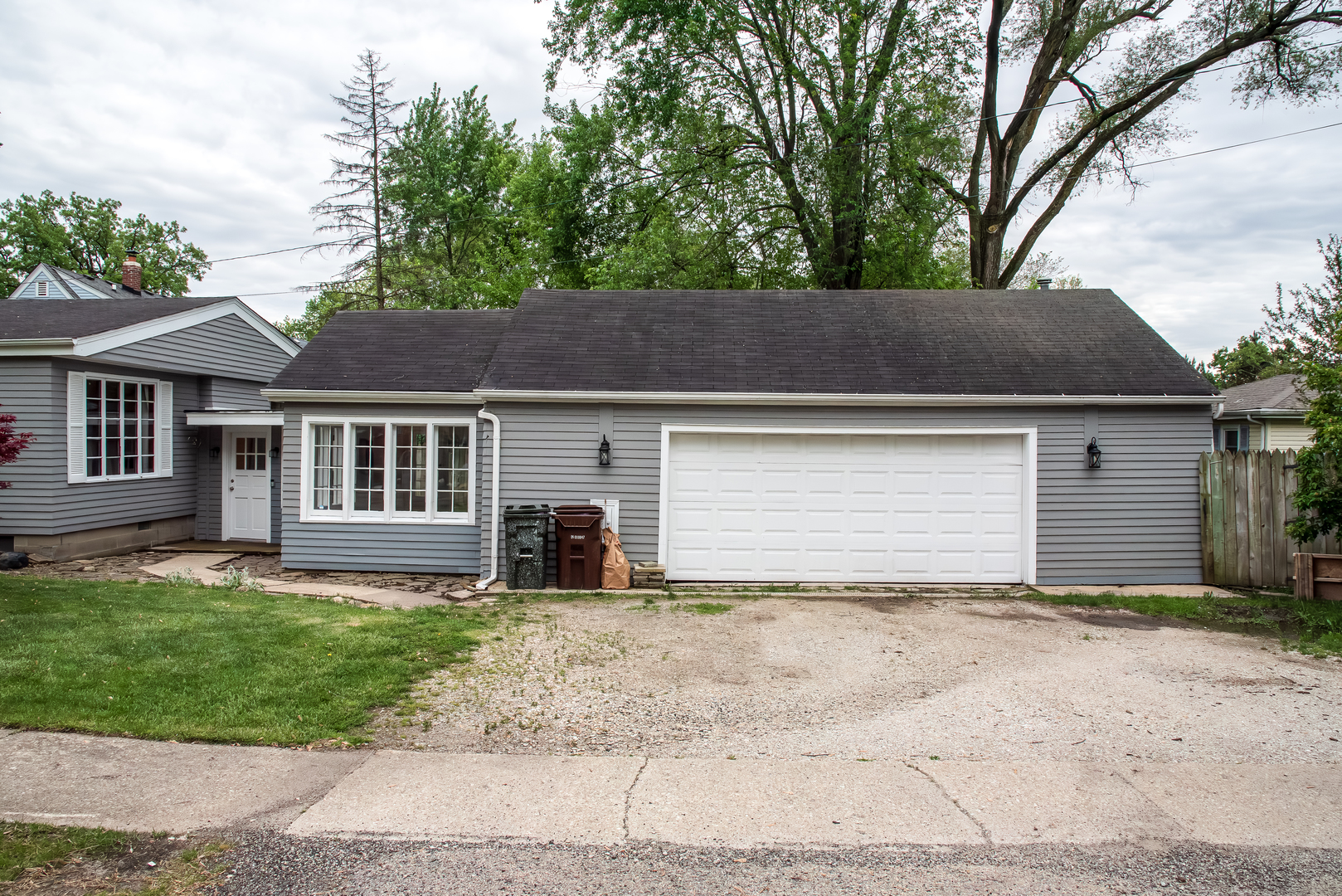 611 North Cedar Road New Lenox, IL 60451 - Photo 6 of 30 a house that has a tree in front of it