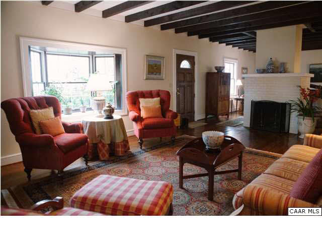 3986 Keswick Road Keswick, VA 22947 - Photo 10 of 15 a living room with furniture and a fireplace