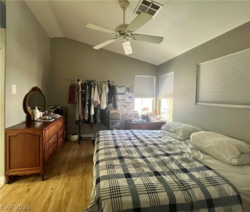 15 Rue Des Champs Henderson, NV 89074 - Photo 8 of 23 Vaulted ceilings and warm wood floors elevate this comfortable space.