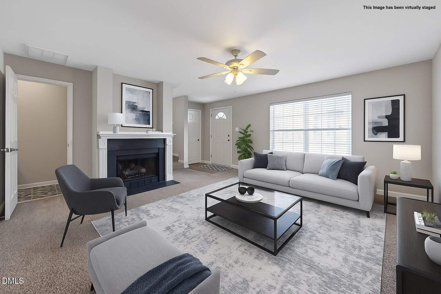 1601 Briarmont Court Raleigh, NC 27610 - Photo 7 of 30 a living room with furniture a fireplace and a table