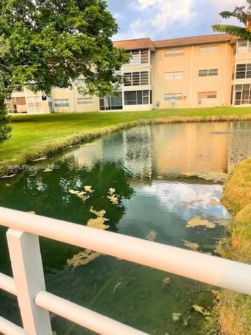 a view of a large yard with an outdoor space and seating area