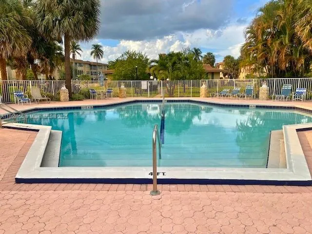a view of a swimming pool with a patio