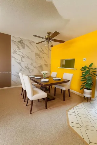 a view of a patio with a table and chairs