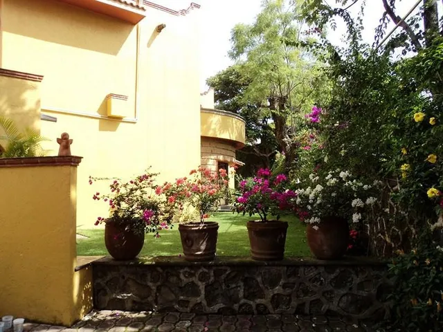 a front view of a house with sitting area