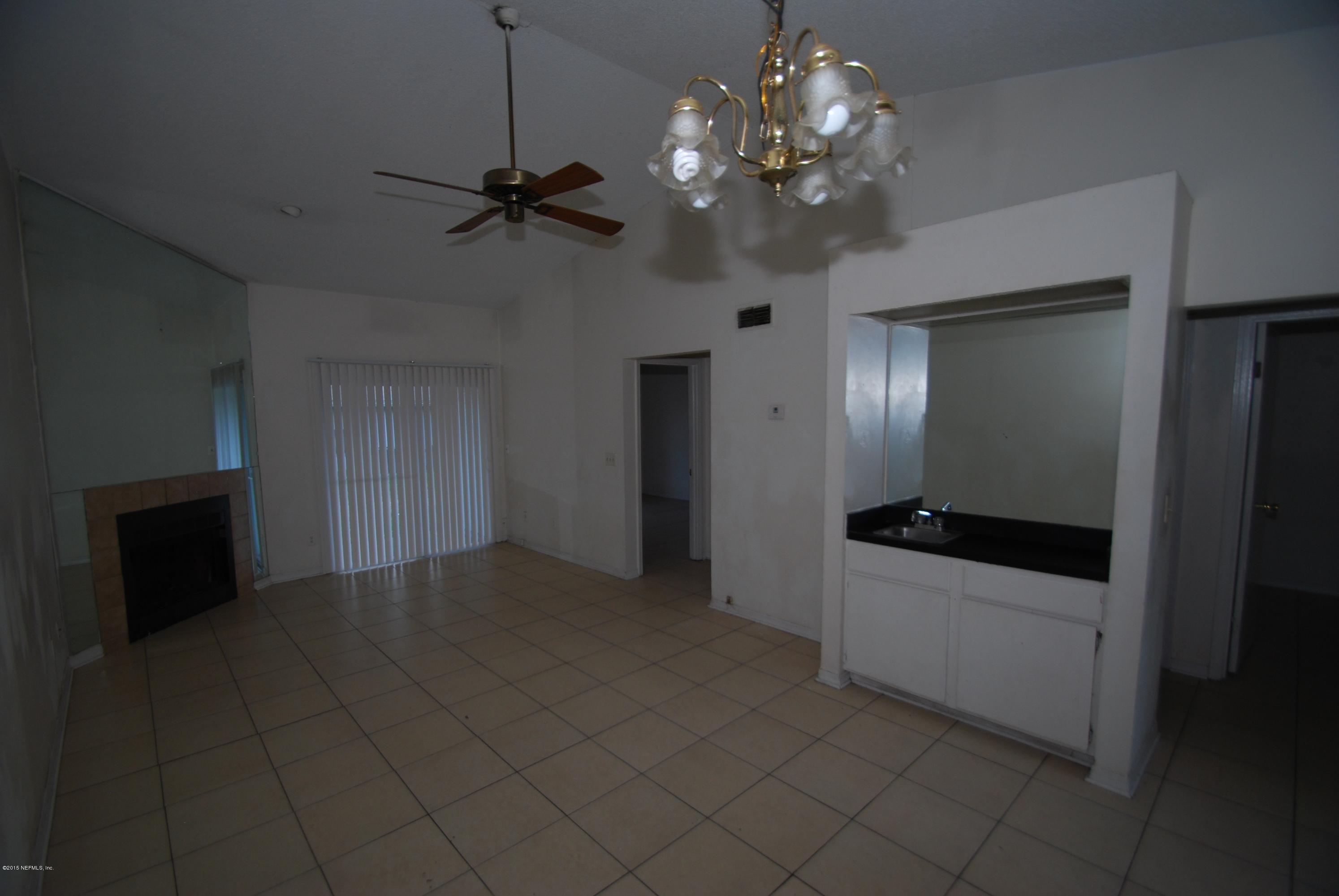 5138 Ricker Road Jacksonville, FL 32210 - Photo 6 of 10 Living Room & Dining Area with Bar Sink