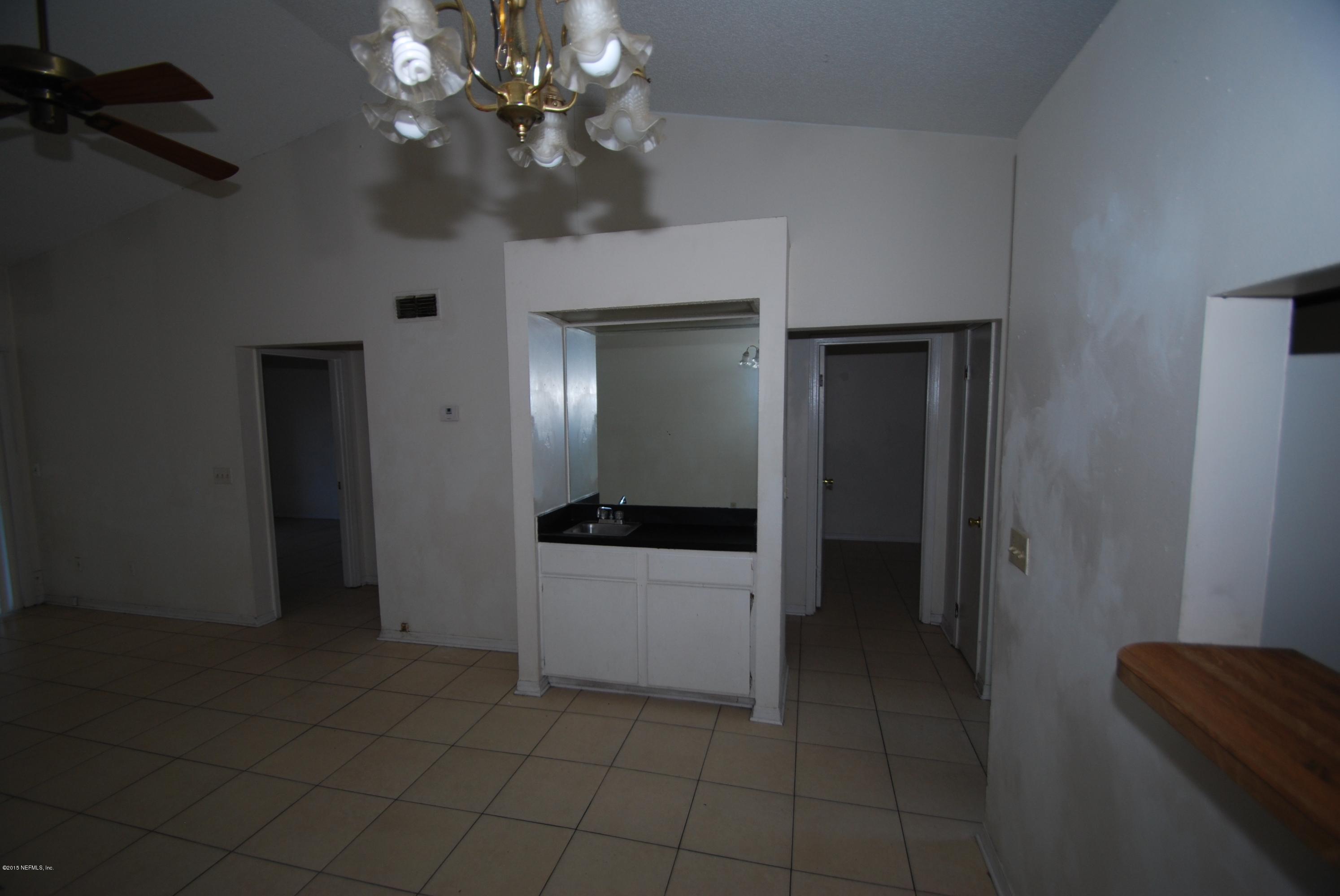 5138 Ricker Road Jacksonville, FL 32210 - Photo 8 of 10 Living Room & Dining Area with Bar Sink