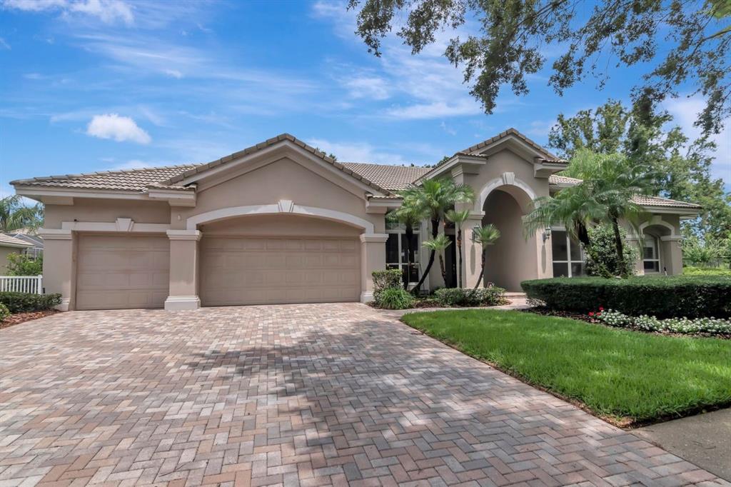 9204 Highland Ridge Way Tampa, FL 33647 - Photo 1 of 1 a front view of a house with a yard and garage