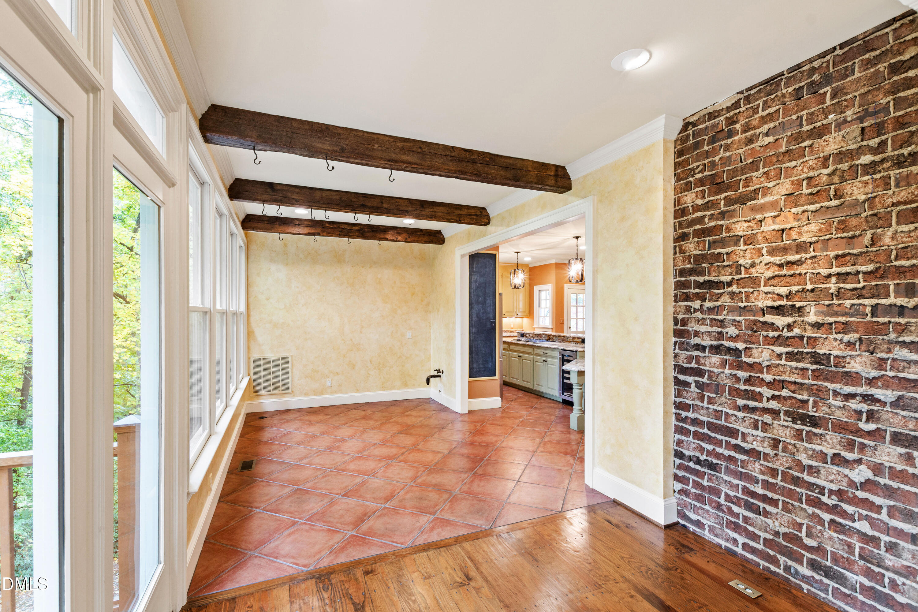 3324 Landor Road Raleigh, NC 27609 - Photo 13 of 69 a view of a hallway with wooden floor and staircase