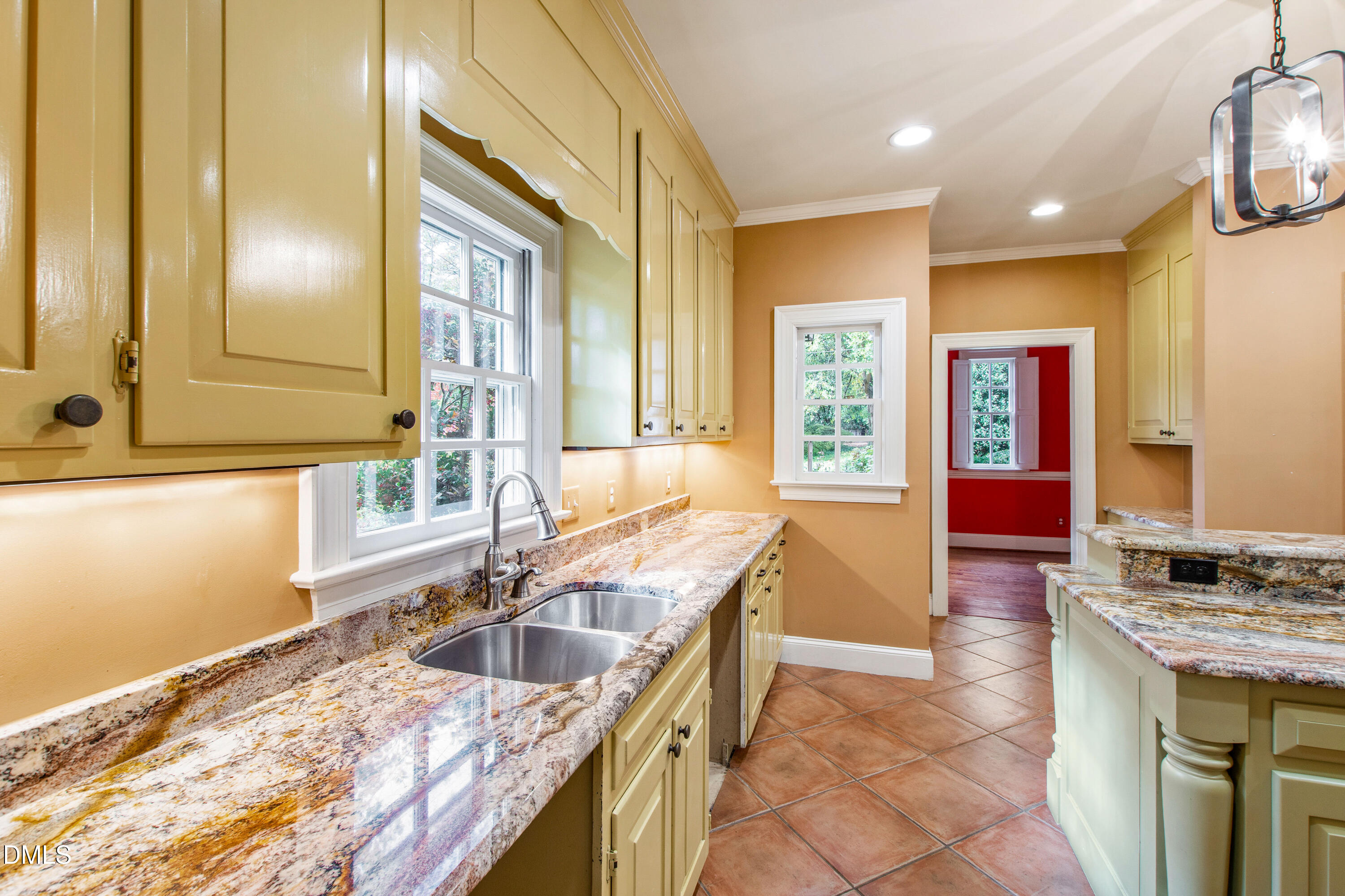 3324 Landor Road Raleigh, NC 27609 - Photo 19 of 69 a kitchen with granite countertop a sink and a stove