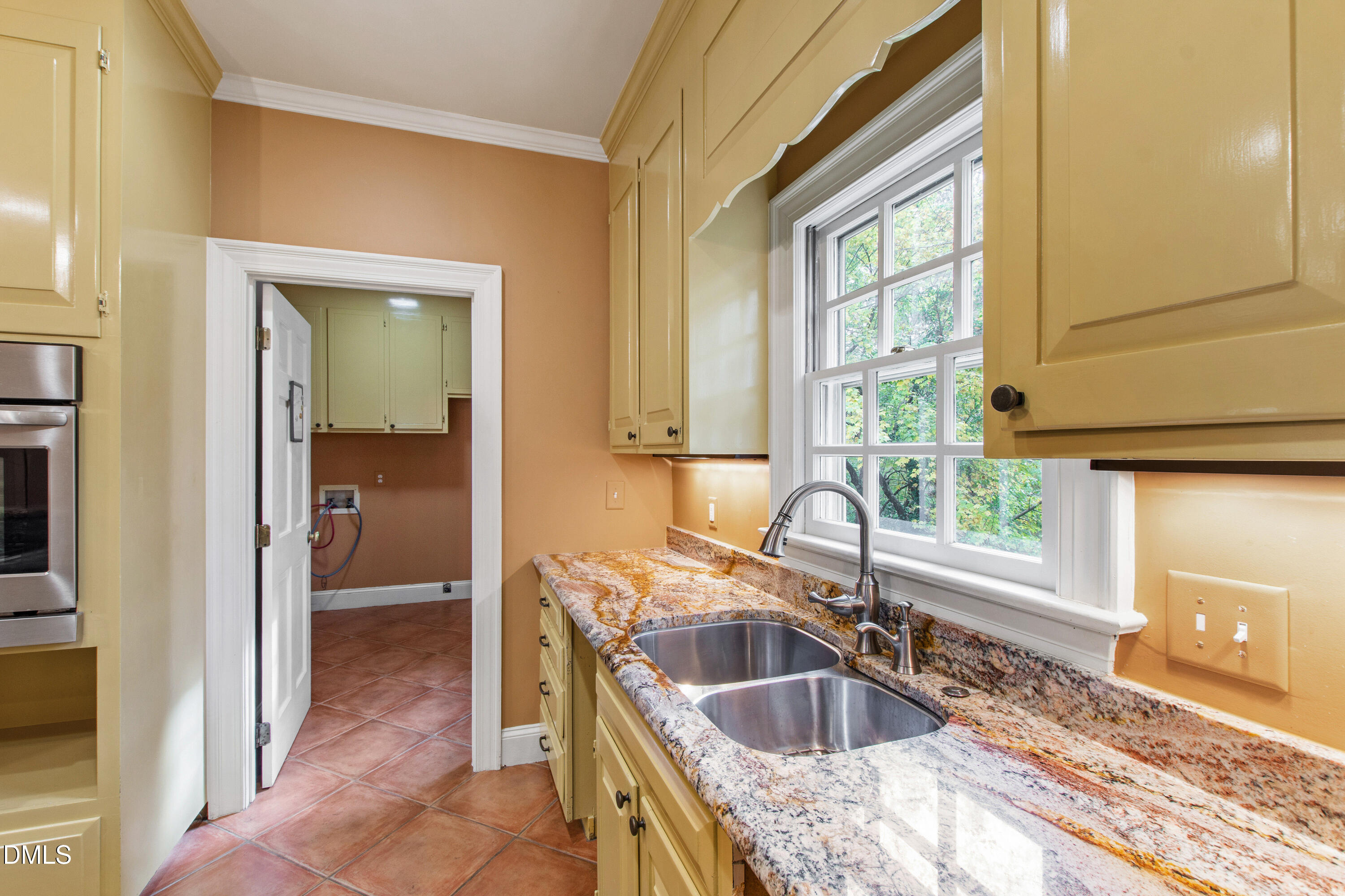3324 Landor Road Raleigh, NC 27609 - Photo 20 of 69 a kitchen with granite countertop a sink and a stove top oven