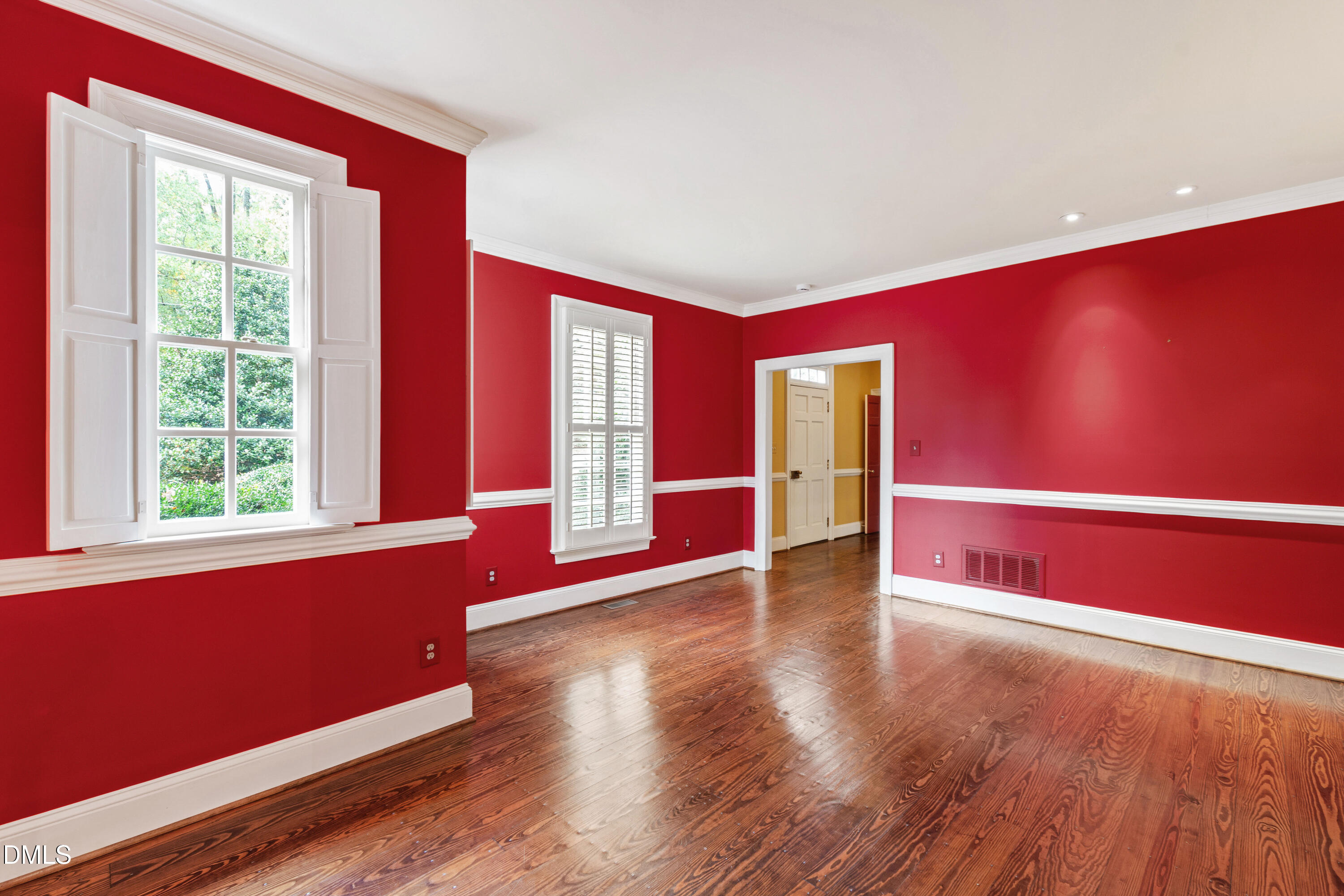 3324 Landor Road Raleigh, NC 27609 - Photo 26 of 69 a view of an empty room with wooden floor and windows
