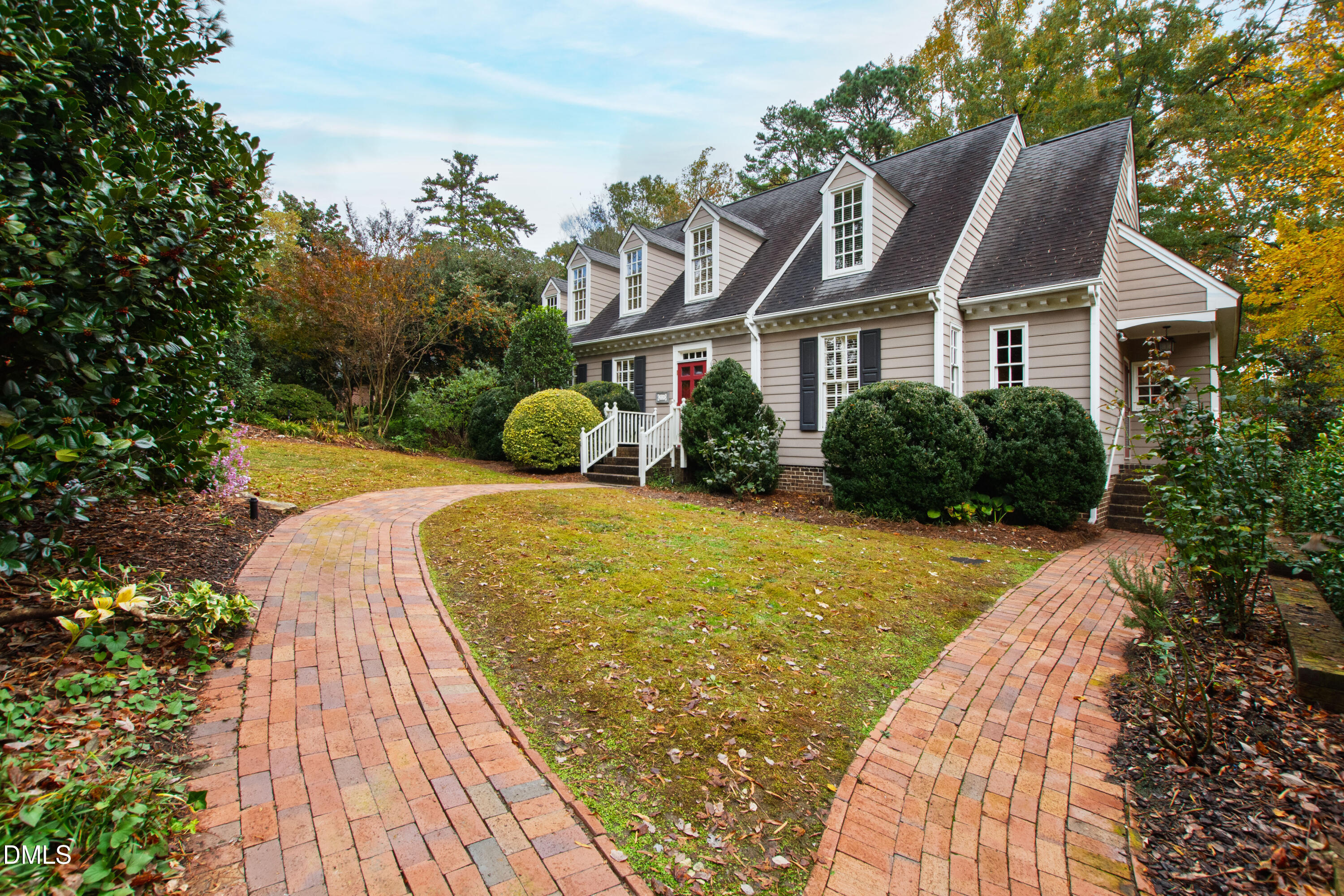 3324 Landor Road Raleigh, NC 27609 - Photo 2 of 69 a view of house with garden space and trees