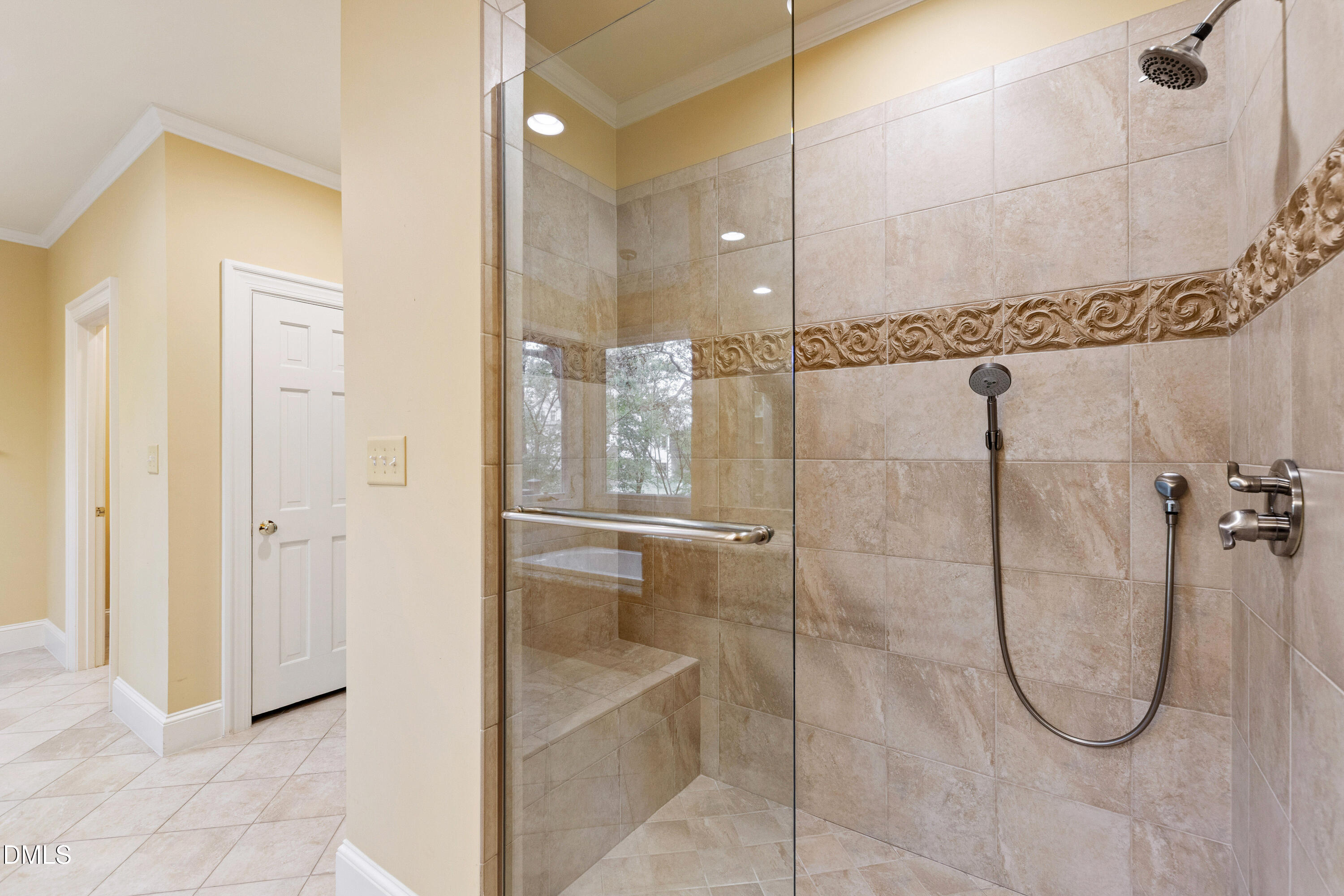 3324 Landor Road Raleigh, NC 27609 - Photo 36 of 69 a bathroom with a glass shower door