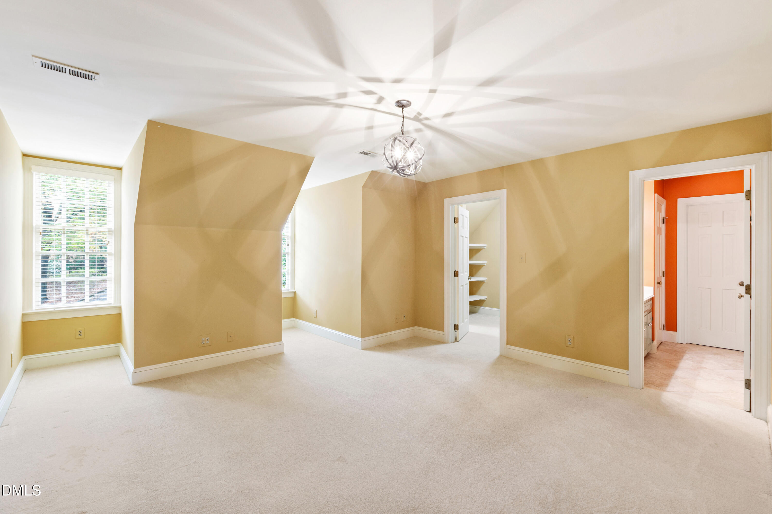 3324 Landor Road Raleigh, NC 27609 - Photo 42 of 69 a view of an empty room with chandelier fan and a window