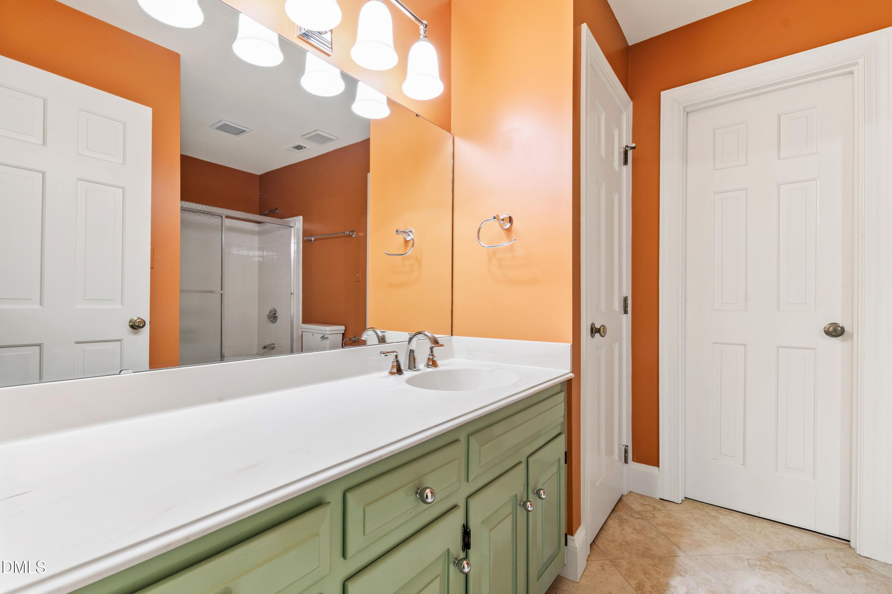 3324 Landor Road Raleigh, NC 27609 - Photo 49 of 69 a bathroom with a sink and a mirror