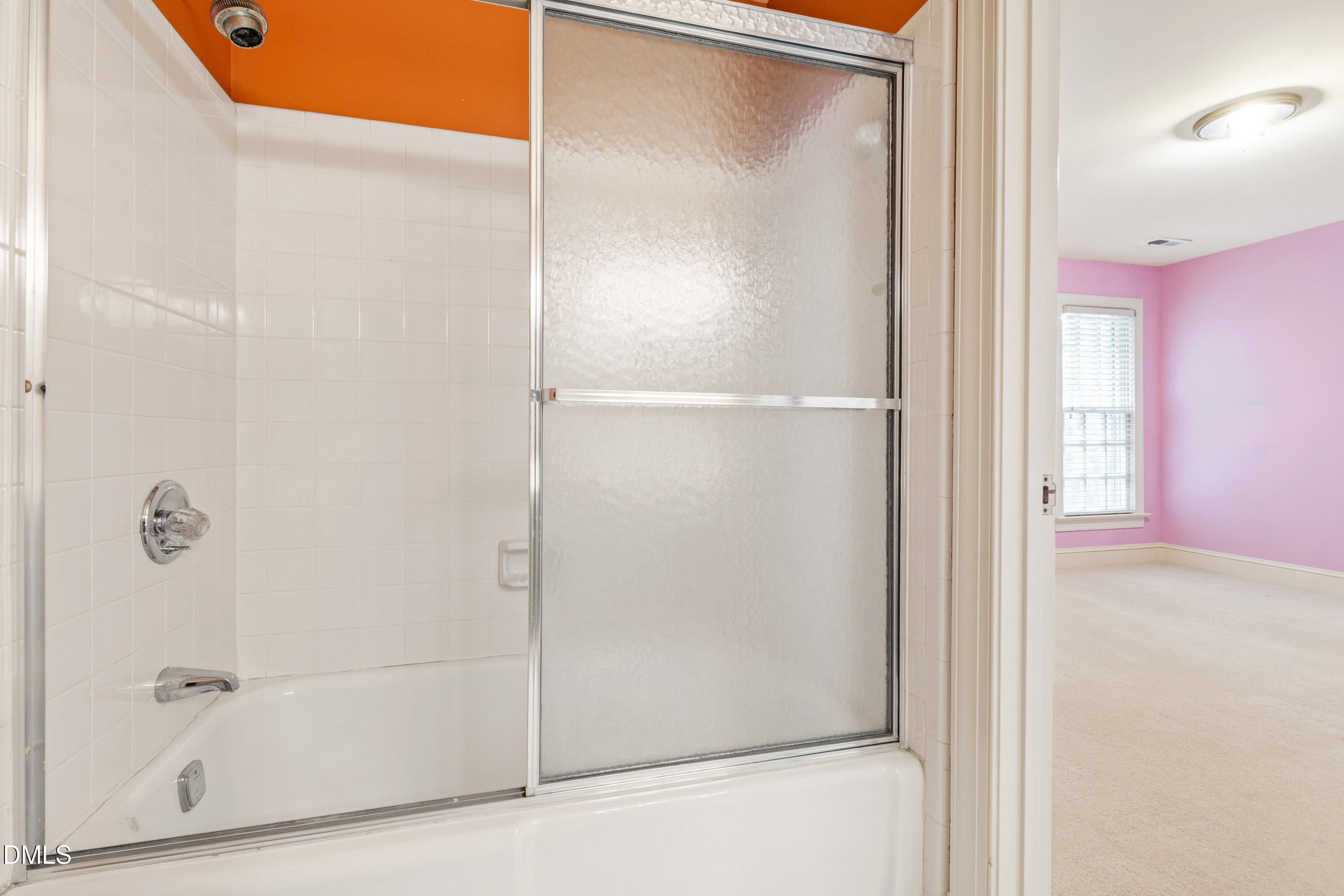 3324 Landor Road Raleigh, NC 27609 - Photo 50 of 69 a bathroom with a glass shower door
