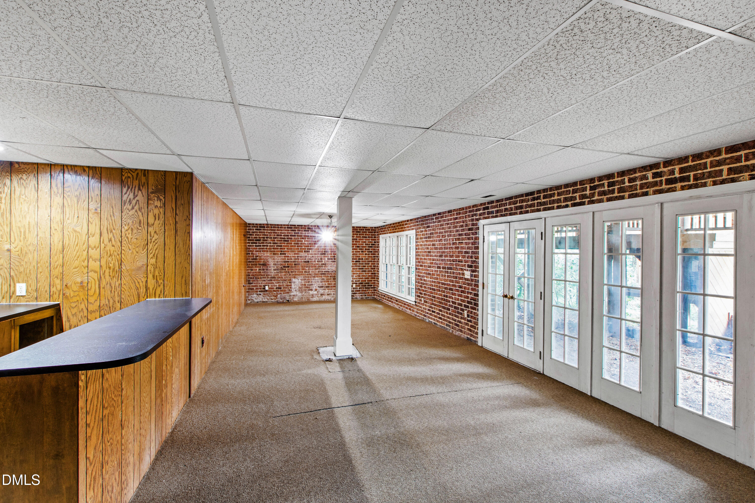 3324 Landor Road Raleigh, NC 27609 - Photo 54 of 69 a view of a hallway with furniture and floor to ceiling window