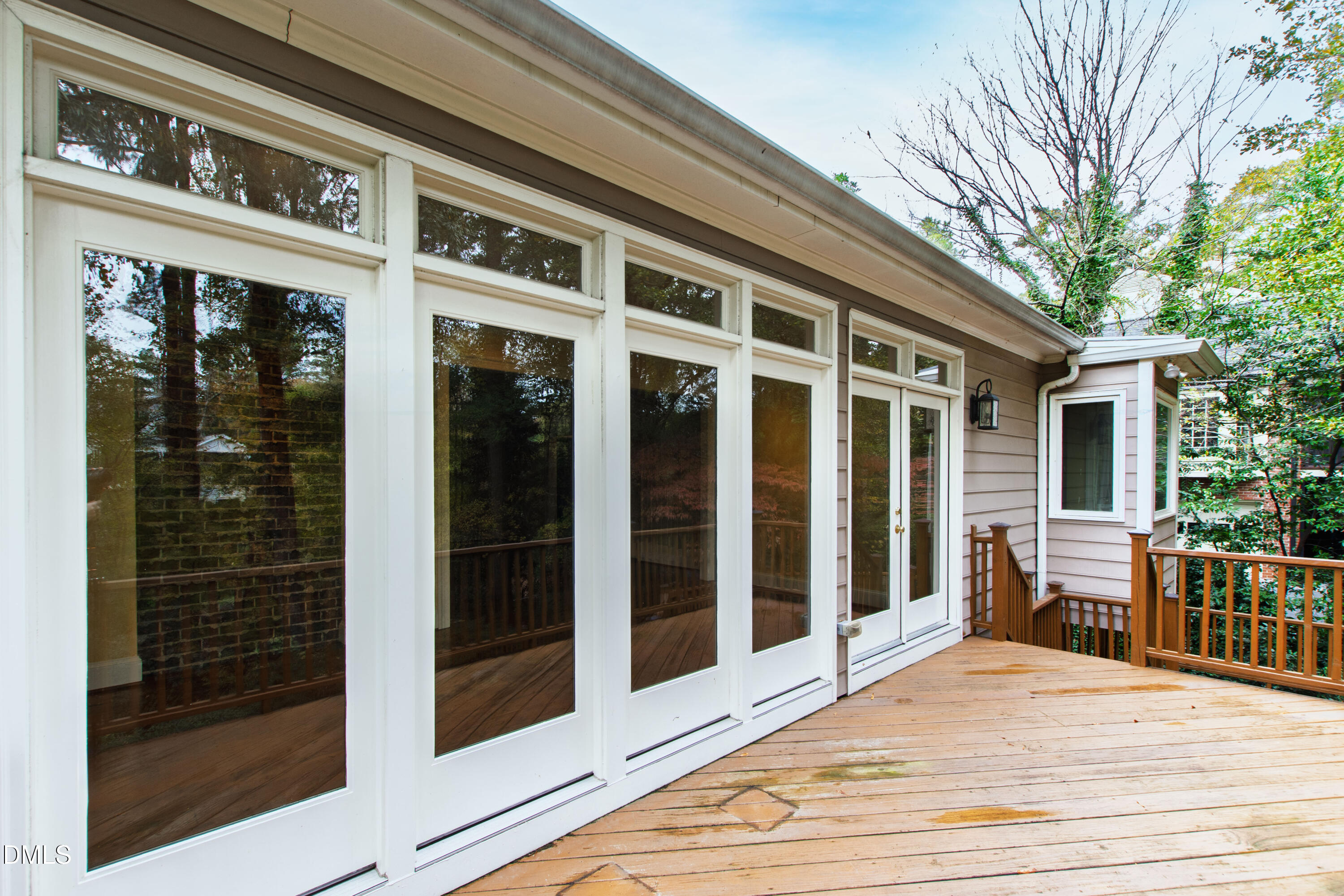 3324 Landor Road Raleigh, NC 27609 - Photo 58 of 69 a view of a balcony with a large window and wooden floor