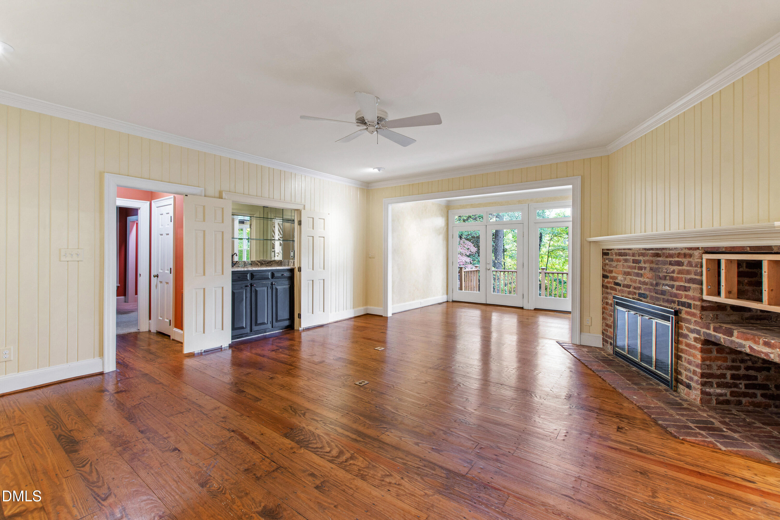 3324 Landor Road Raleigh, NC 27609 - Photo 8 of 69 a view of an empty room with window and wooden floor