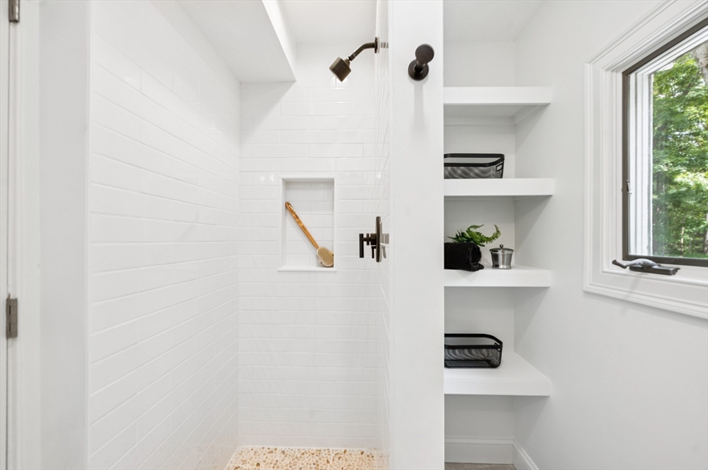 37 Hillside Road Boxford, MA 01921 - Photo 17 of 27 a white cabinet with a close up of a sink