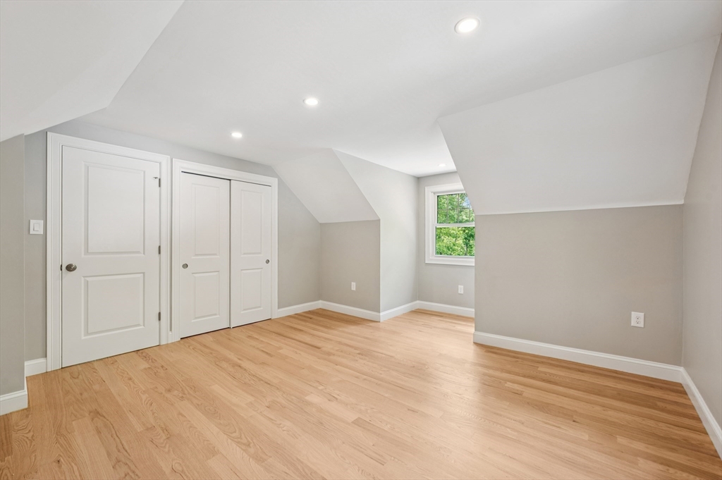 37 Hillside Road Boxford, MA 01921 - Photo 18 of 27 a view of an empty room with wooden floor and windows