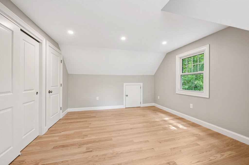 37 Hillside Road Boxford, MA 01921 - Photo 19 of 27 a view of an empty room with wooden floor and a window