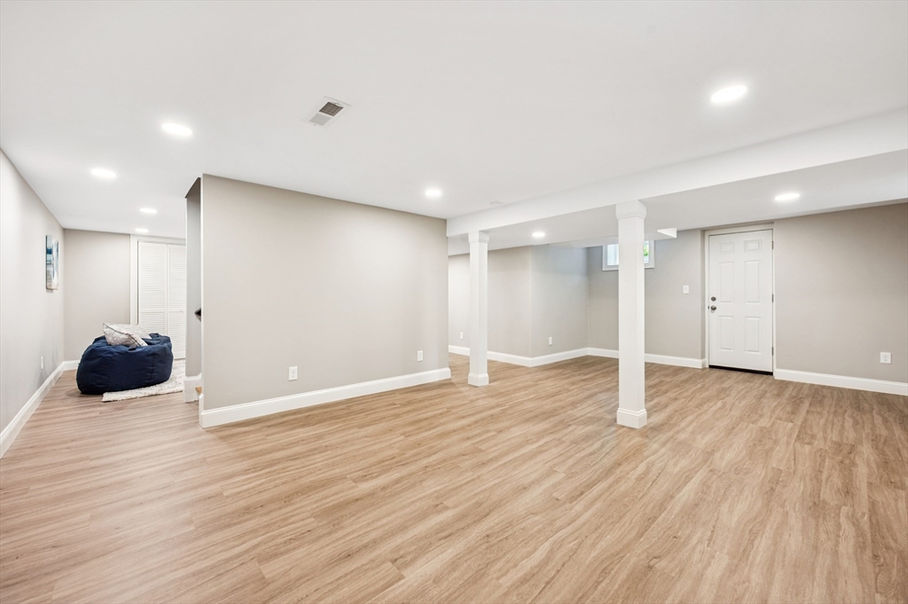 37 Hillside Road Boxford, MA 01921 - Photo 23 of 27 a view of an empty room with wooden floor