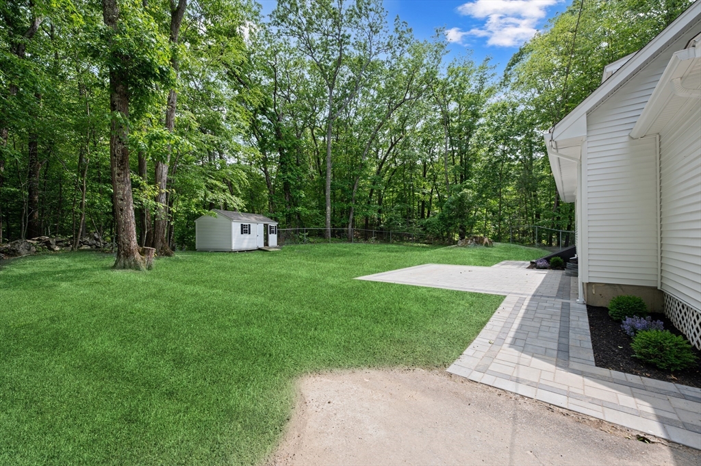 37 Hillside Road Boxford, MA 01921 - Photo 27 of 27 a view of a backyard with a garden