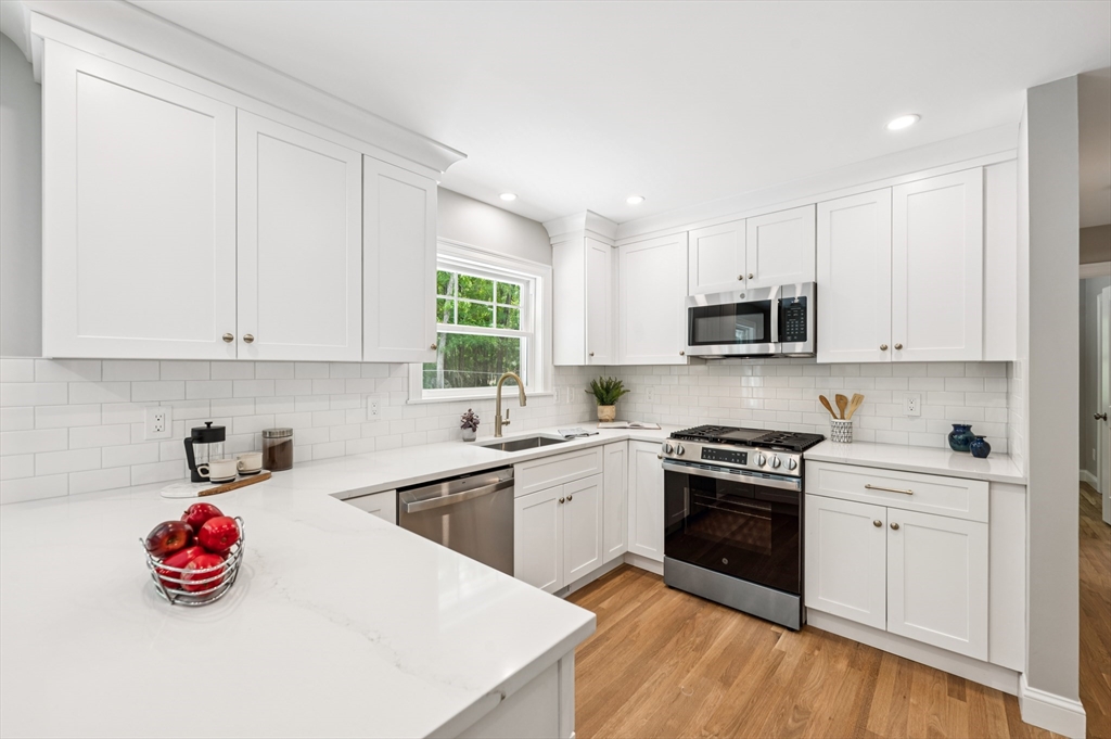 37 Hillside Road Boxford, MA 01921 - Photo 5 of 27 a kitchen with white cabinets and appliances