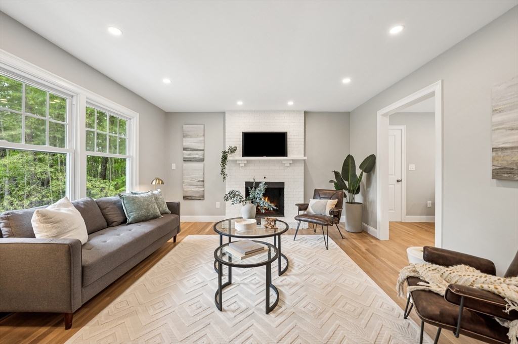 37 Hillside Road Boxford, MA 01921 - Photo 7 of 27 a living room with furniture and a flat screen tv