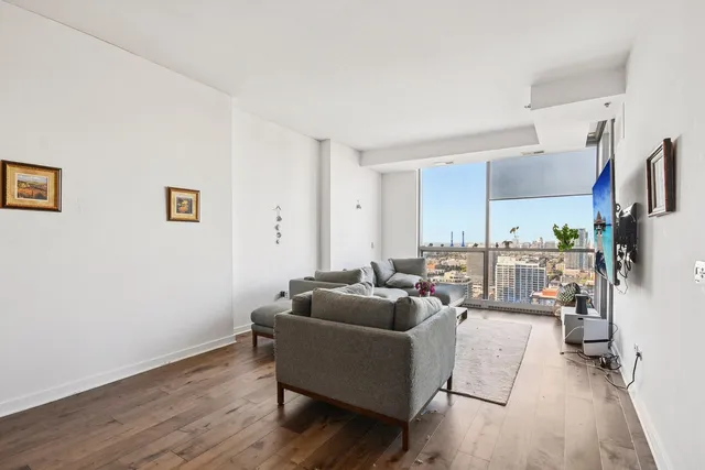 a living room with furniture and a large window