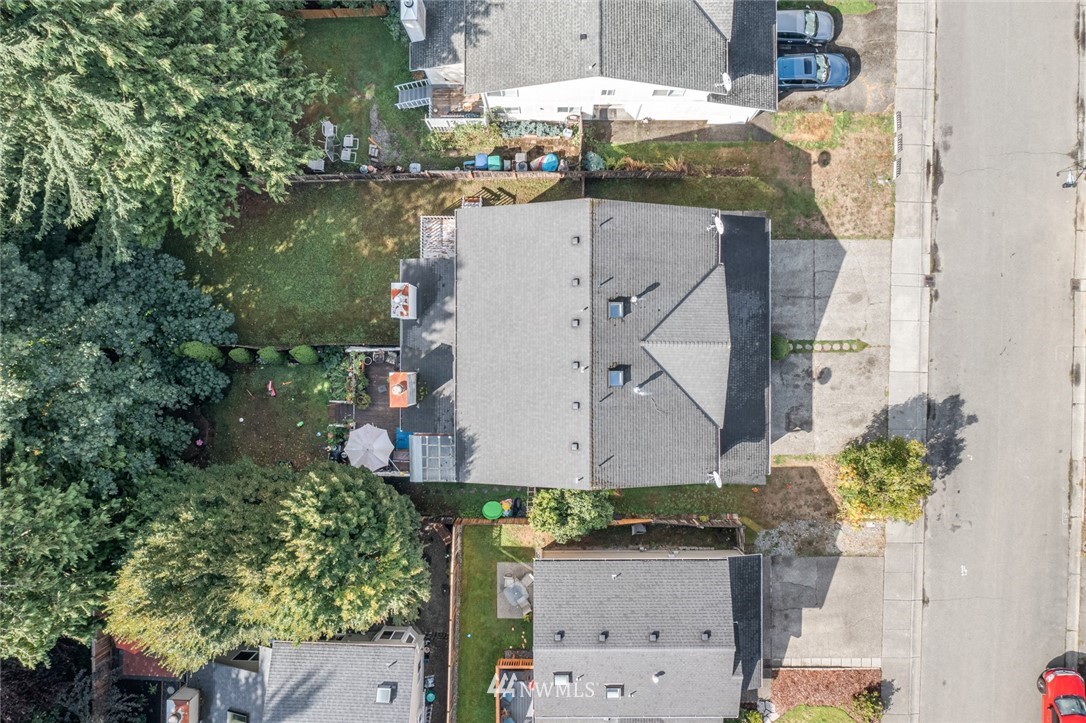 2220 164th Place Southeast Bothell, WA 98012 - Photo 8 of 33 an aerial view of a house with a yard and a large tree