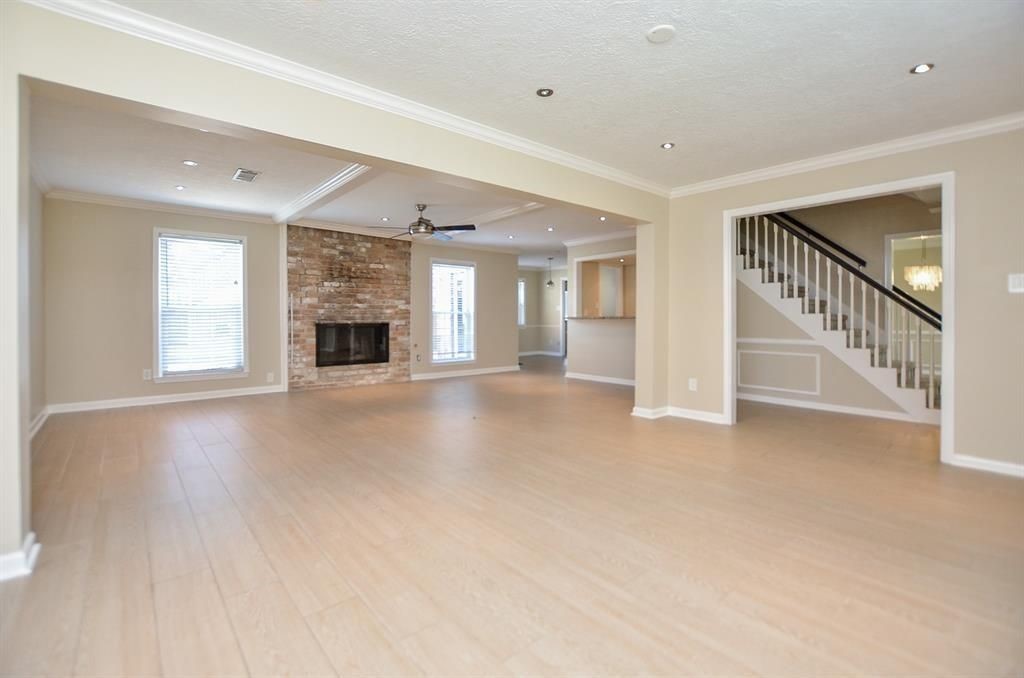 11502 Wickersham Lane Houston, TX 77077 - Photo 12 of 22 a view of an empty room with fireplace and a window