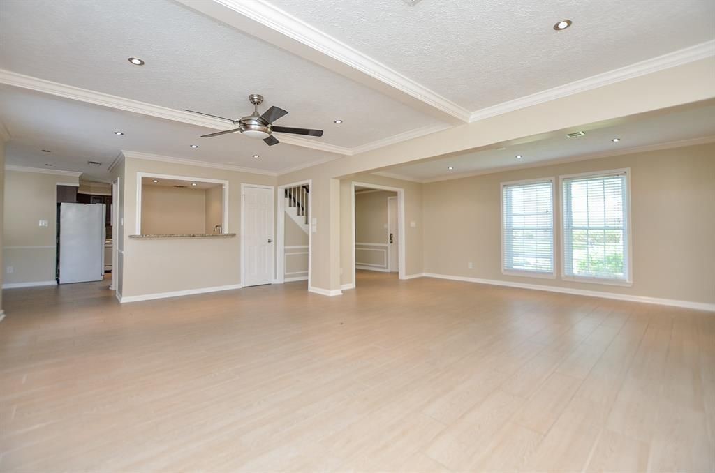 11502 Wickersham Lane Houston, TX 77077 - Photo 13 of 22 an empty room with a empty space and windows