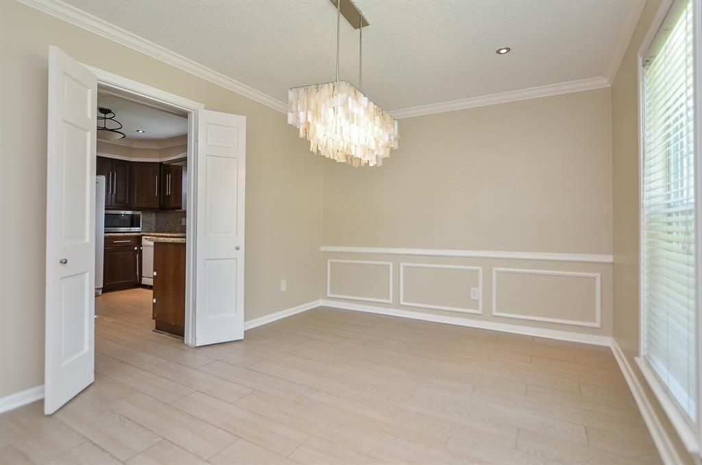 11502 Wickersham Lane Houston, TX 77077 - Photo 14 of 22 a view of an empty room with a window