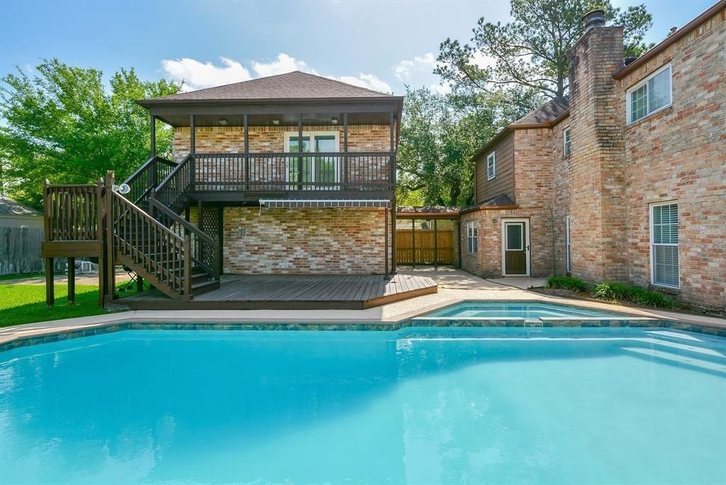 11502 Wickersham Lane Houston, TX 77077 - Photo 20 of 22 a view of outdoor space yard and swimming pool