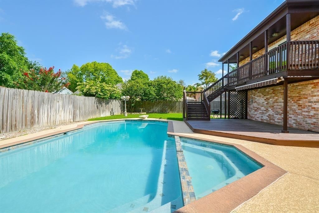11502 Wickersham Lane Houston, TX 77077 - Photo 3 of 22 a view of swimming pool with a yard