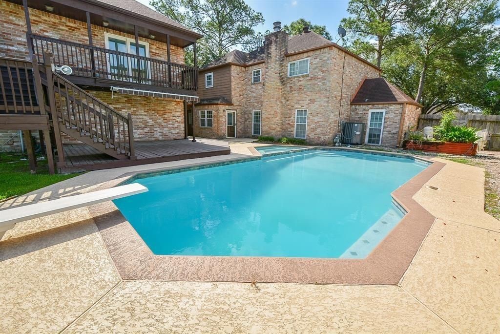 11502 Wickersham Lane Houston, TX 77077 - Photo 6 of 22 a view of a house with backyard and sitting area