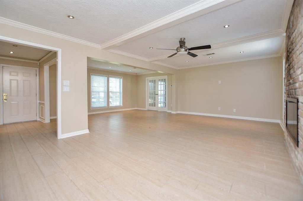 11502 Wickersham Lane Houston, TX 77077 - Photo 8 of 22 wooden floor in an empty room with a window