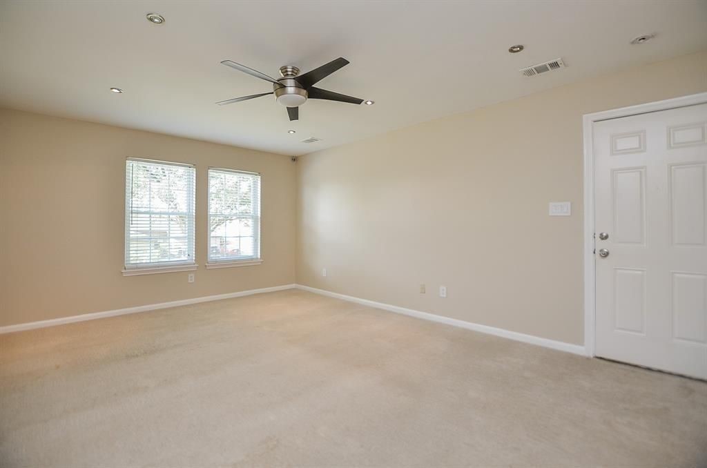 11502 Wickersham Lane Houston, TX 77077 - Photo 9 of 22 a view of an empty room with a window
