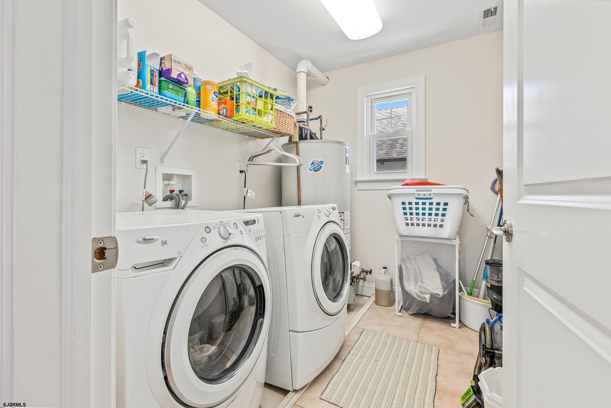 29 North Iroquois Avenue, Unit 6/16/26 FLEXIBLE WITH START DATE Margate City, NJ 08402 - Photo 23 of 40 a utility room with dryer and washer