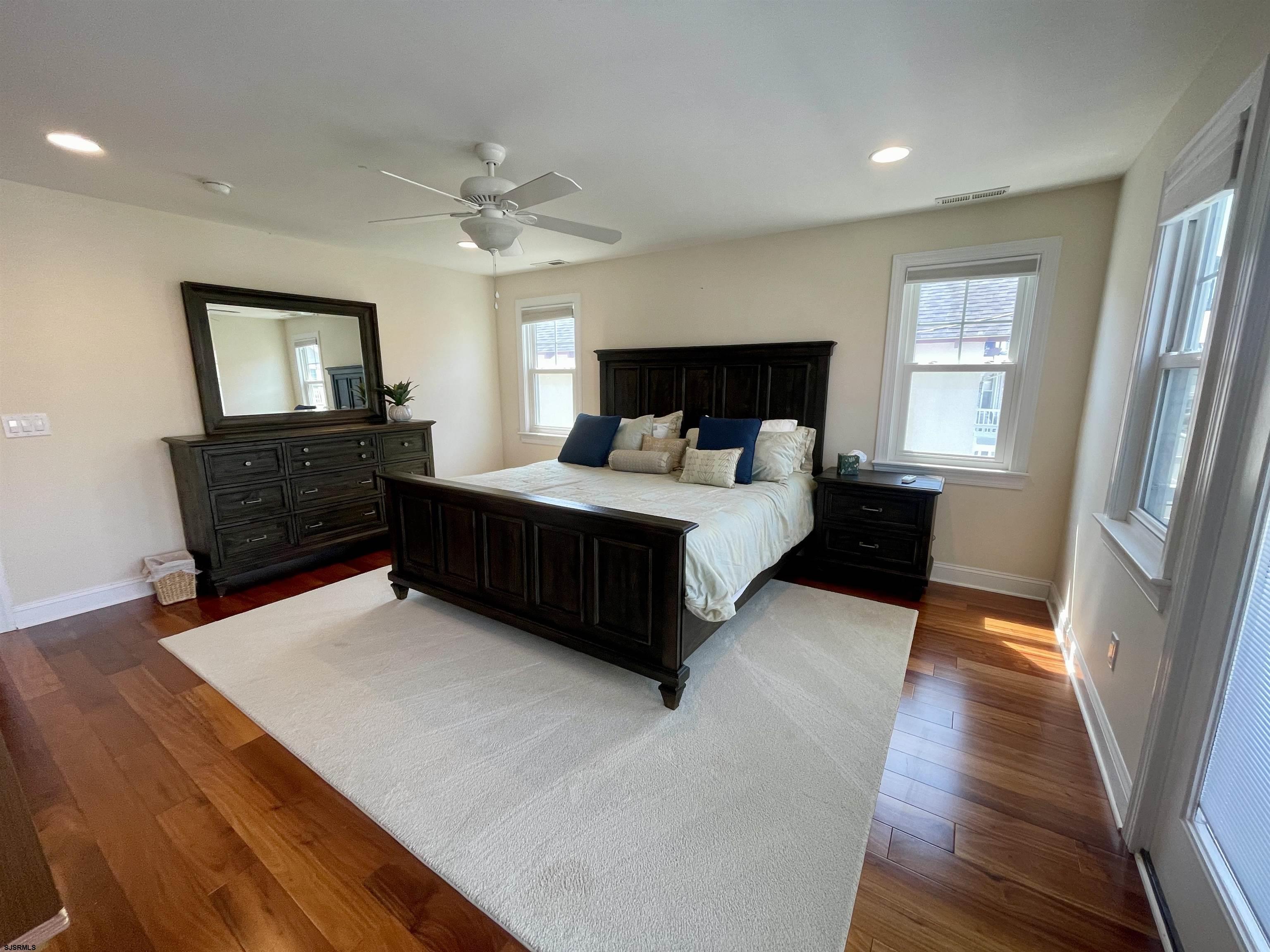 29 North Iroquois Avenue, Unit 6/16/26 FLEXIBLE WITH START DATE Margate City, NJ 08402 - Photo 25 of 40 a bedroom with a bed window and a dresser