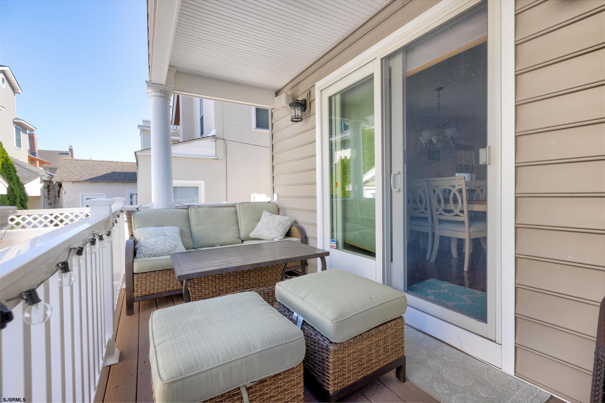 29 North Iroquois Avenue, Unit 6/16/26 FLEXIBLE WITH START DATE Margate City, NJ 08402 - Photo 38 of 40 a outdoor living space with furniture