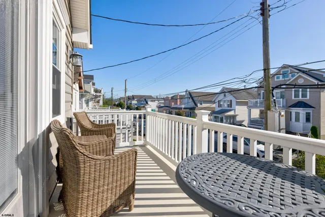 a view of a balcony with furniture