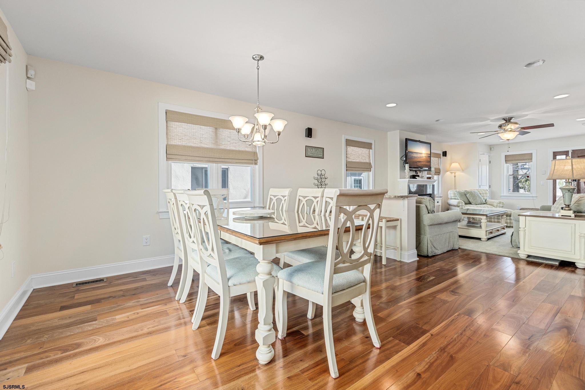 29 North Iroquois Avenue, Unit 6/16/26 FLEXIBLE WITH START DATE Margate City, NJ 08402 - Photo 10 of 40 a view of a dining room with furniture and wooden floor