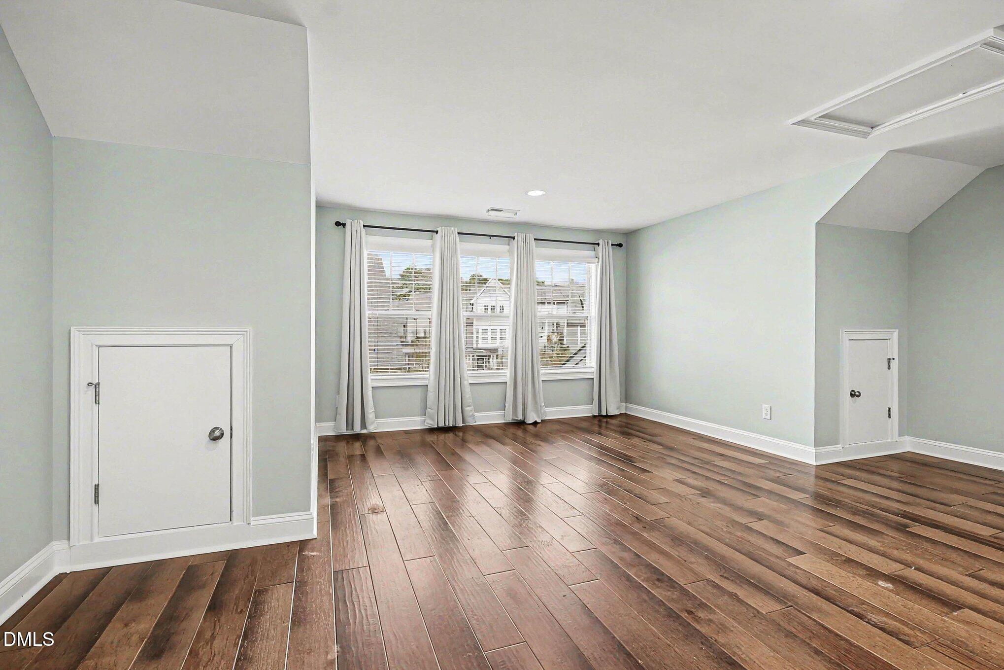 653 Fallon Grove Way Raleigh, NC 27608 - Photo 23 of 38 wooden floor in an empty room