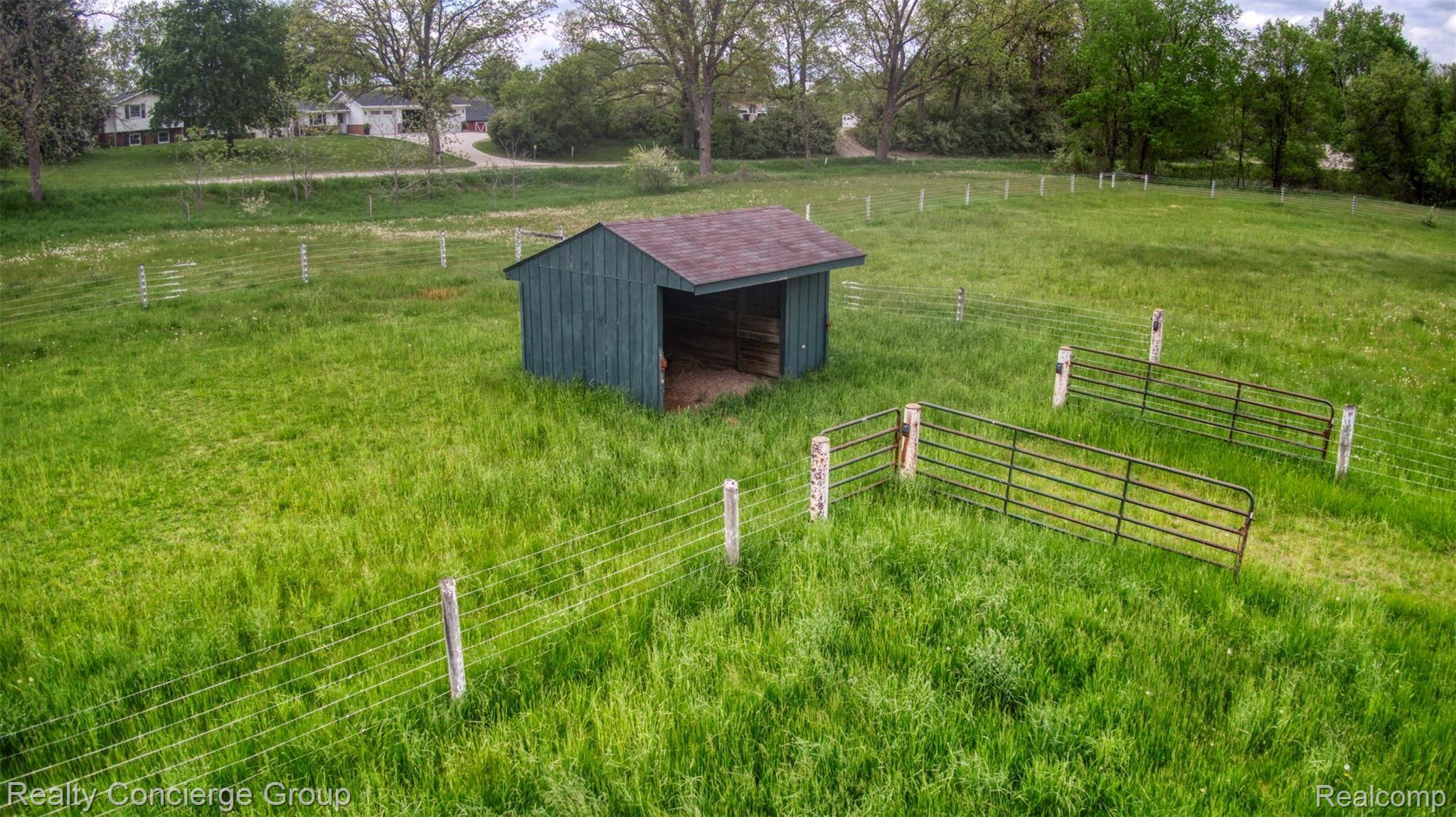 2110 East Clyde Road Howell, MI 48855 - Photo 30 of 44 Shed and electric fencing ready for your next farm animal